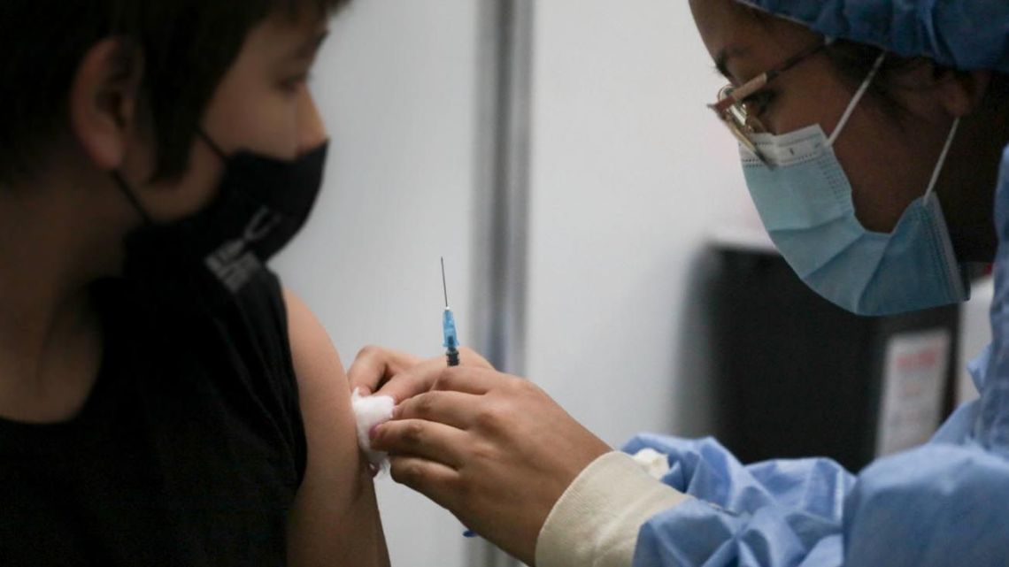 A health worker applies a dose of coronavirus vaccine at a health centre in Buenos Aires.