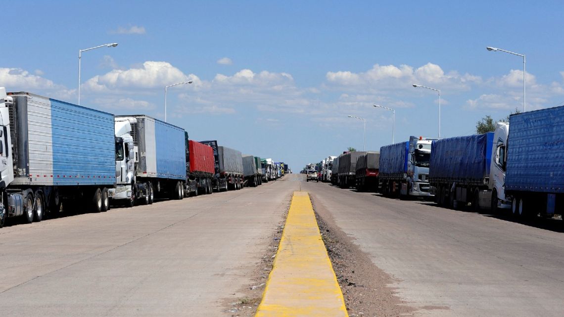 Trucks remain parked in the industrial zone of Luján de Cuyo, Mendoza Province, near the Cristo Redentor-Libertadores international crossing between Argentina and Chile, on January 30, 2022.