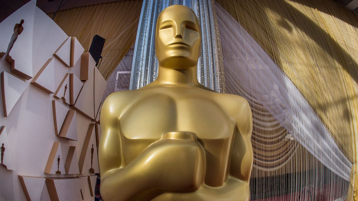 An Oscars statue is displayed on the red carpet area on the eve of the 92nd Oscars ceremony at the Dolby Theatre in Hollywood, California. A crowded field including 'Dune,' 'Belfast,' 'West Side Story' and 'The Power of the Dog' will compete for Oscars, as Academy voters handpick the best films from a year in which Covid-weary audiences slowly headed back into movie theatre. 