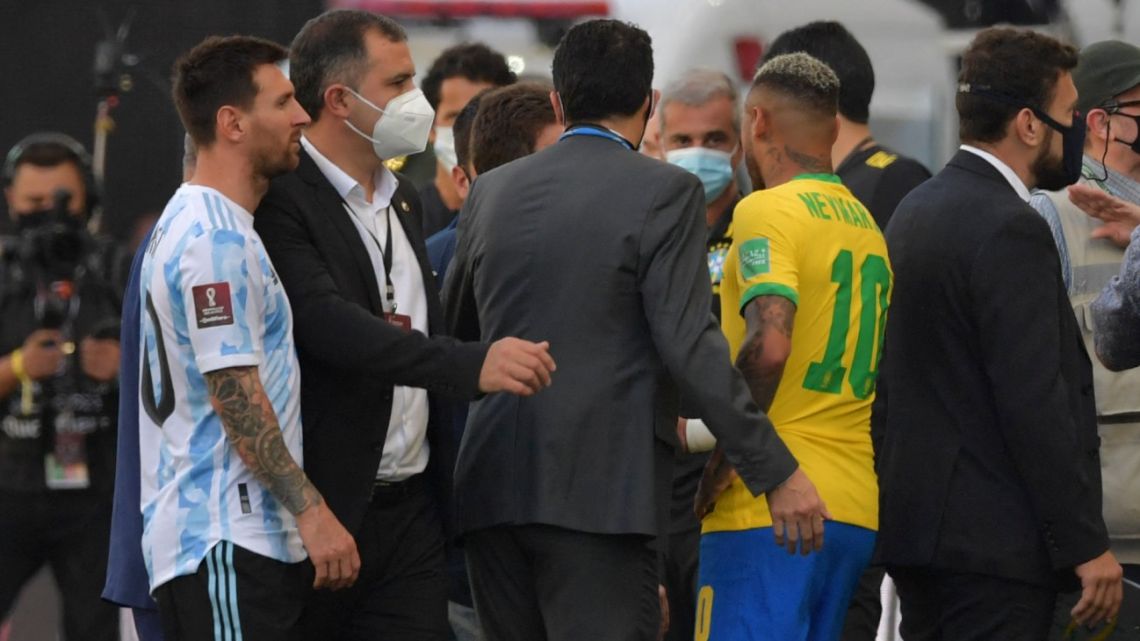 In this file photo taken on September 5, 2021, Argentina's Lionel Messi (left) and Brazil's Neymar are seen after employees of Brazil's National Health Surveillance Agency (Anvisa) entered to the field during the South American qualification football match for the FIFA World Cup Qatar 2022 at the Neo Quimica Arena, also known as Corinthians Arena, in São Paulo, Brazil. 