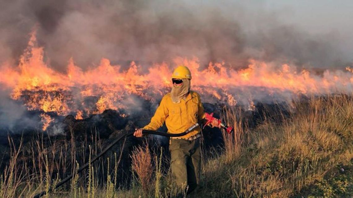 A firefighter battles flames in Corrientes Province.