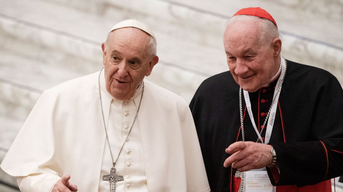 Pope Francis arrives with Cardinal Marc Ouellet of Canada for opening of three-day Symposium on priesthood in the Paul VI hall at the Vatican on February 17, 2022. Tiziana FABI / AFP