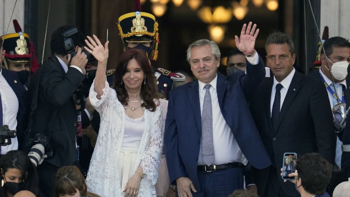 President Alberto Fernández and Vice-President Cristina Fernández de Kirchner wave next to Lower House Speaker Serio Massa after the inauguration of the 140th period of ordinary sessions in the Congress in Buenos Aires, on March 1, 2022. 