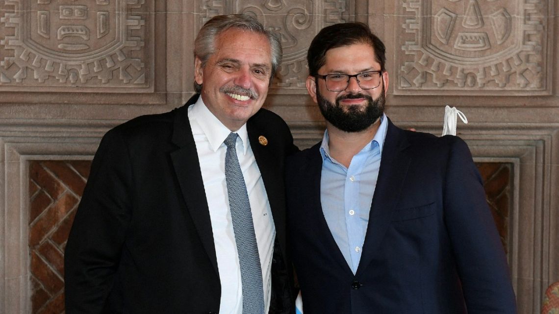 Handout photo released by the Chilean Presidency of Chilean President Gabriel Boric posing with Argentine President Alberto Fernández in Santiago on March 11, 2022.