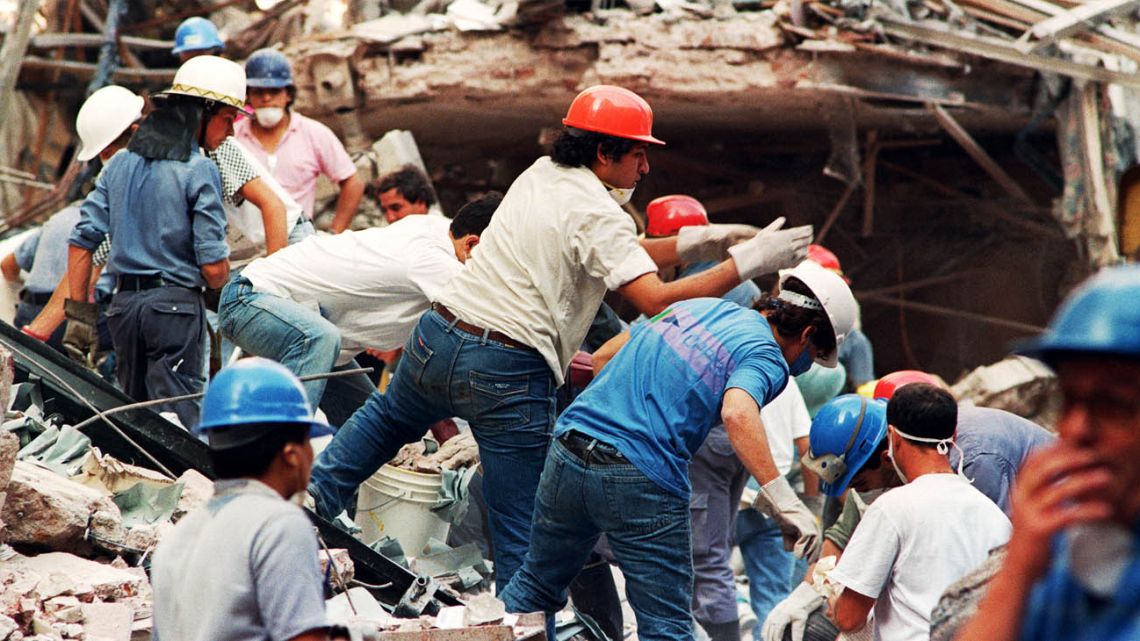 In this file photo taken on March 18, 1992, firemen and rescue workers continue to dig through the ruins of the Israeli Embassy in Buenos Aires after a night of search following the 17 March explosion of a powerful car bomb which virtually destroyed the diplomatic building.