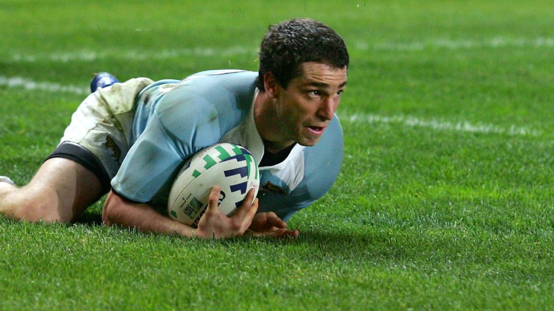 In this file photo taken on October 19, 2007, Federico Martín Aramburú scores for Argentina during the rugby union World Cup third place final match France vs Argentina, at the Parc des Princes stadium in Paris. 