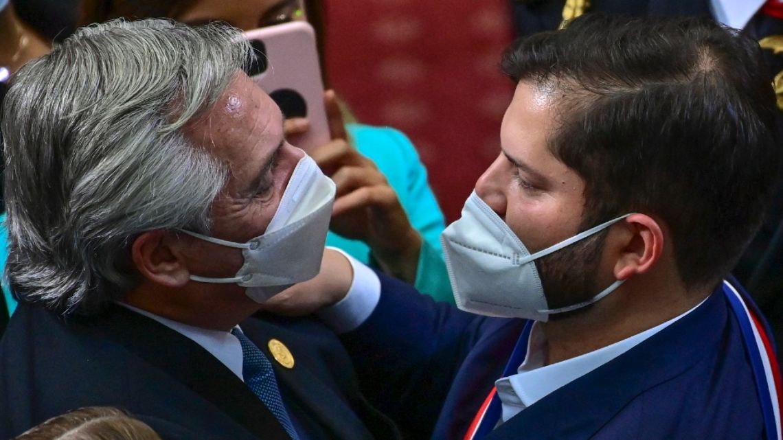 In this file photo taken on March 11, 2022, Chile's new President Gabriel Boric (right) is greeted by Argentina's President Alberto Fernández after his inauguration ceremony at the Chilean Congress in Valparaíso.