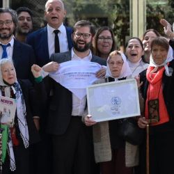Chile’s President Gabriel Boric (centre) – accompanied by President Alberto Fernández, Human Rights Secretary Horacio Pietragalla, Justice & Human Rights Minister Martín Soria and members of the Madres de Plaza de Mayo human rights group Lita Boitano, Nora Cortiñas, Buscarita Roa and Taty Almeida, among others – pays a visit to the ex-ESMA Navy Mechanics' School, which was used as a clandestine torture and detention centre during Argentina’s brutal 1976-1983 military dictatorship in Buenos Aires on April 5, 2022. 