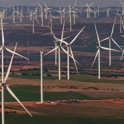 This photograph shows wind turbines in a wind farm in Villar de los Navarros, Zaragoza province in Spain on April 5, 2022.