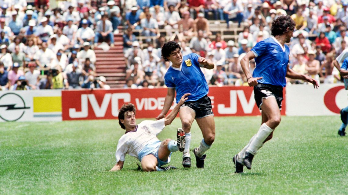 In this file photo taken on June 22, 1986, Diego Maradona vies with English midfielder Steve Hodge for the ball in Mexico City during the World Cup quarter-final match between Argentina and England. 