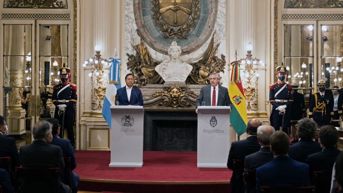 Bolivian President Luis Arce and Argentine President Alberto Fernández deliver a joint press conference during the signing of agreements at the Casa Rosada in Buenos Aires, on April 7, 2022. 