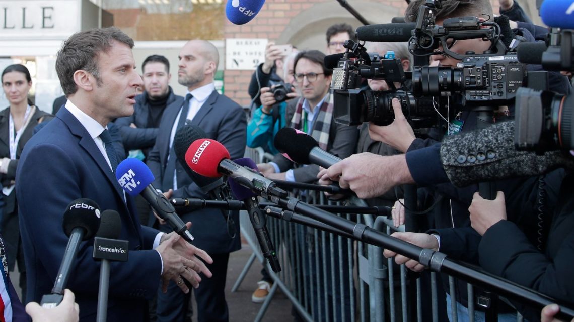 French President and liberal party La Republique en Marche (LREM) candidate for re-election Emmanuel Macron speaks to the press in Denain, northern France, on April 11, 2022. 