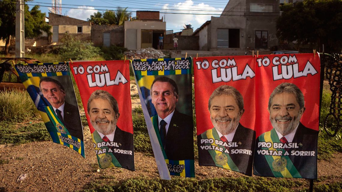 Matheus Silva sells towels featuring the two main candidates for the presidency near Salgueiro, Brazil, in February.