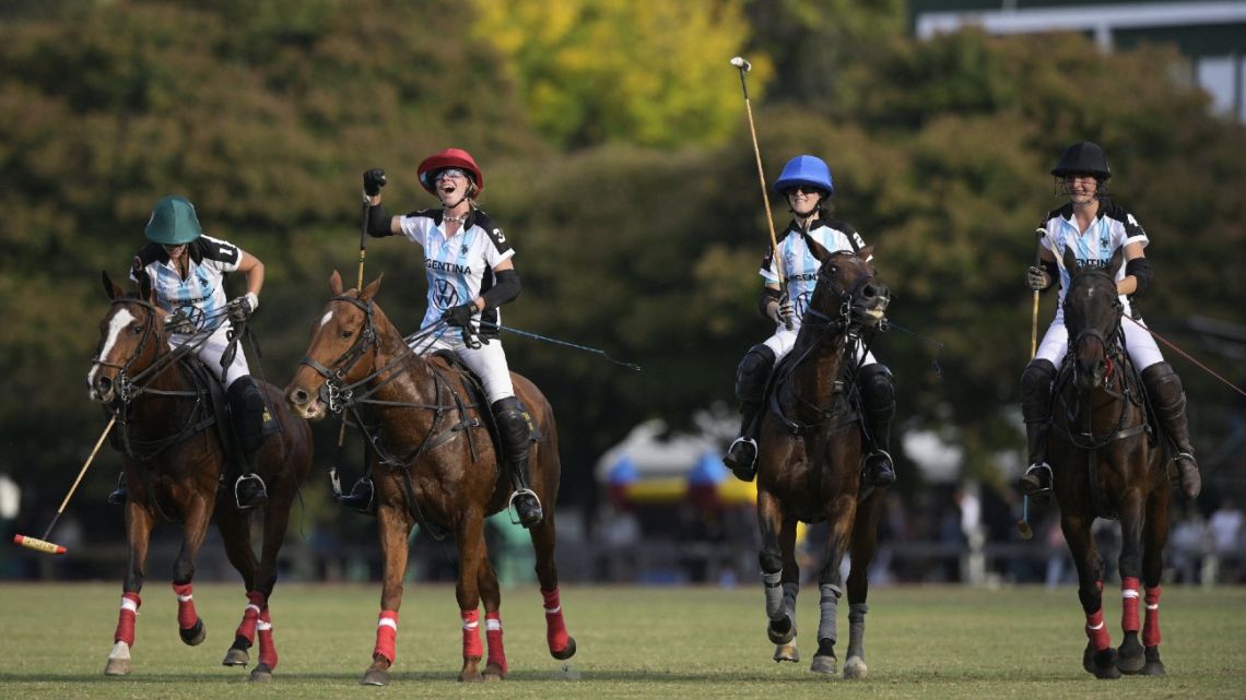 (L-R) Argentina's Agustina Imaz, Catalina Lavinia, Azucena Uranga and Paulina Vasquetto celebrate after winning the women's polo World Cup final match in Buenos Aires on April 16, 2022.