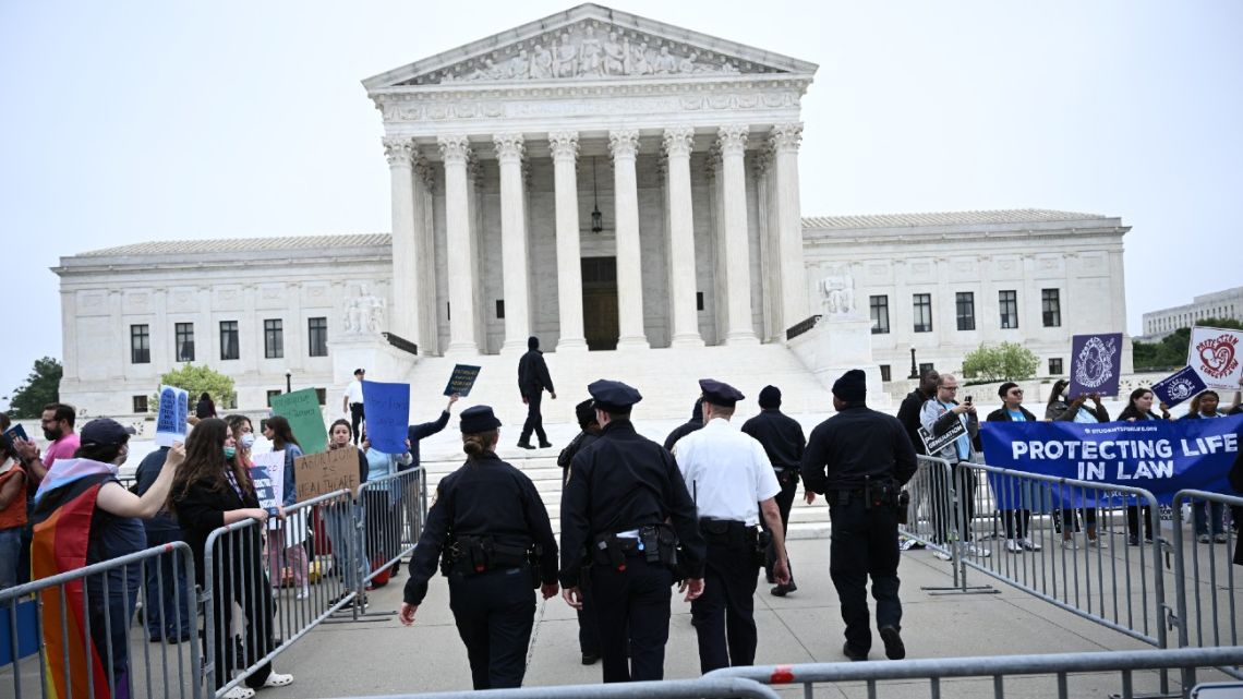 Pro-life and pro-choice demonstrators gather in front of the US Supreme Court in Washington, DC, on May 3, 2022.