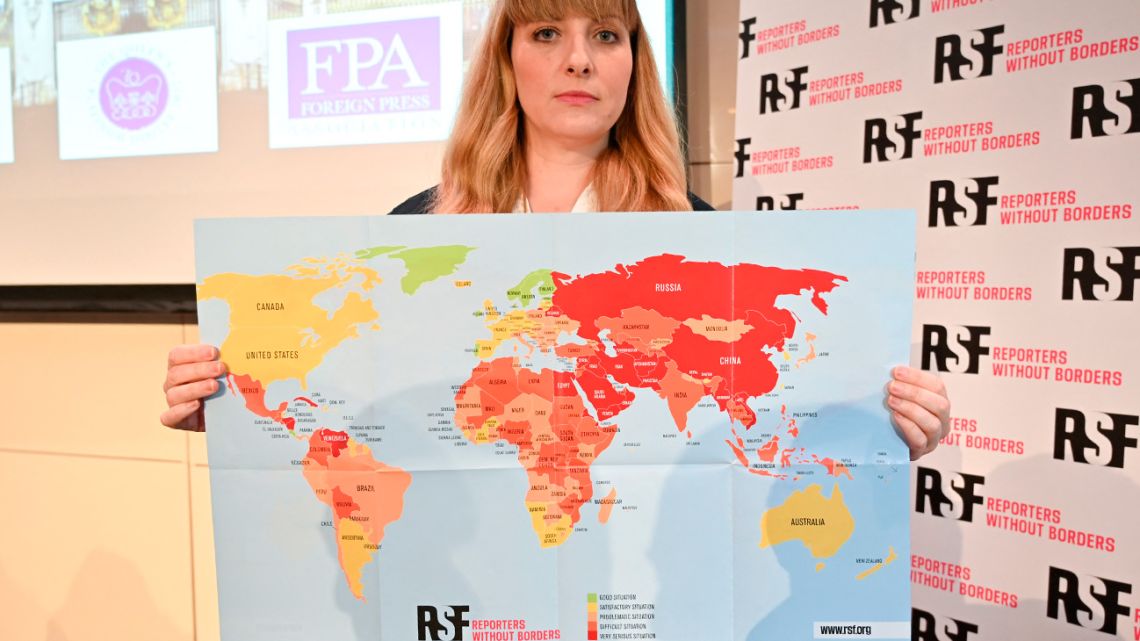 Reporters without Borders (Reporter sans frontieres - RSF) Director of Operations and Campaigns Rebecca Vincent shows the new 2022 World Press Freedom Index map during the Reporters Without Borders press conference, at Royal Overseas League, in London on May 3, 2022. 