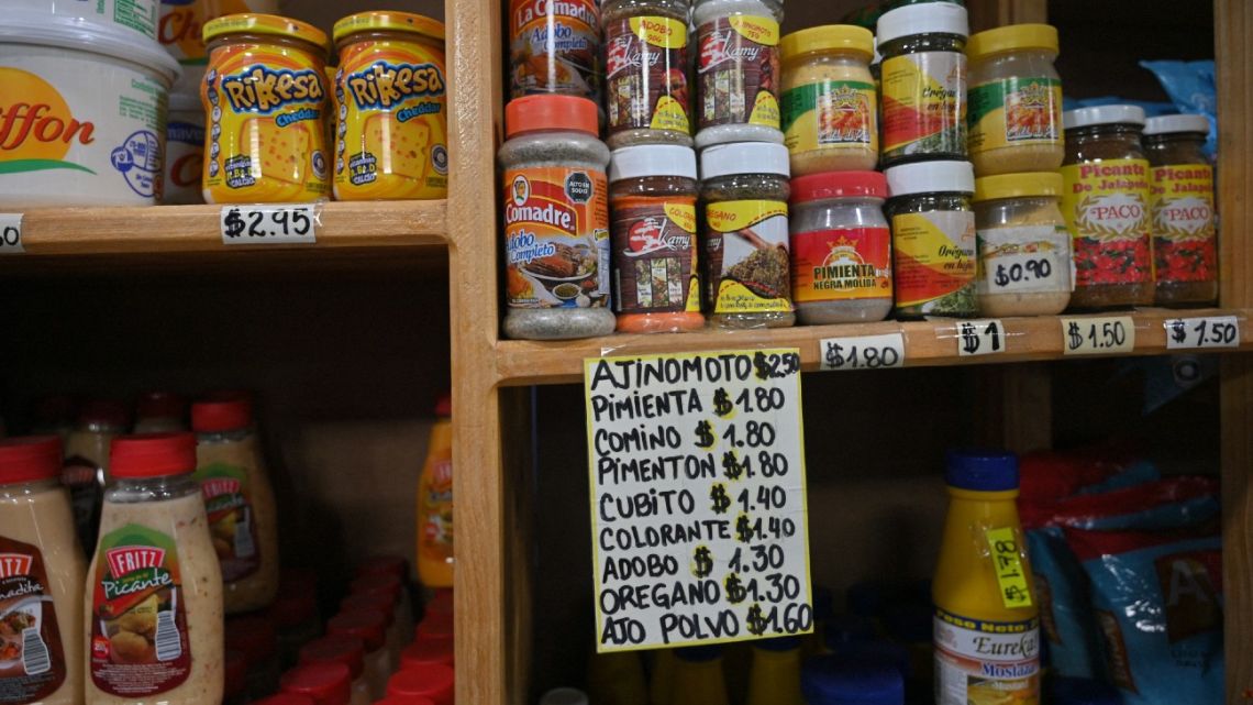 Products are displayed with their prices in US dollars at a store in Caracas on April 22, 2022.