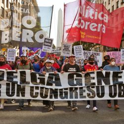 Members of social organisations and leftist groups march towards the Plaza de Mayo to demand the government take urgent action against rampant inflation, in Buenos Aires on May 12, 2022.