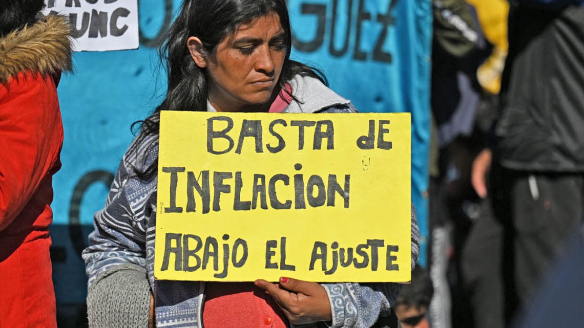 A protester holds up a sign complaining about inflation at a demonstration in Buenos Aires.