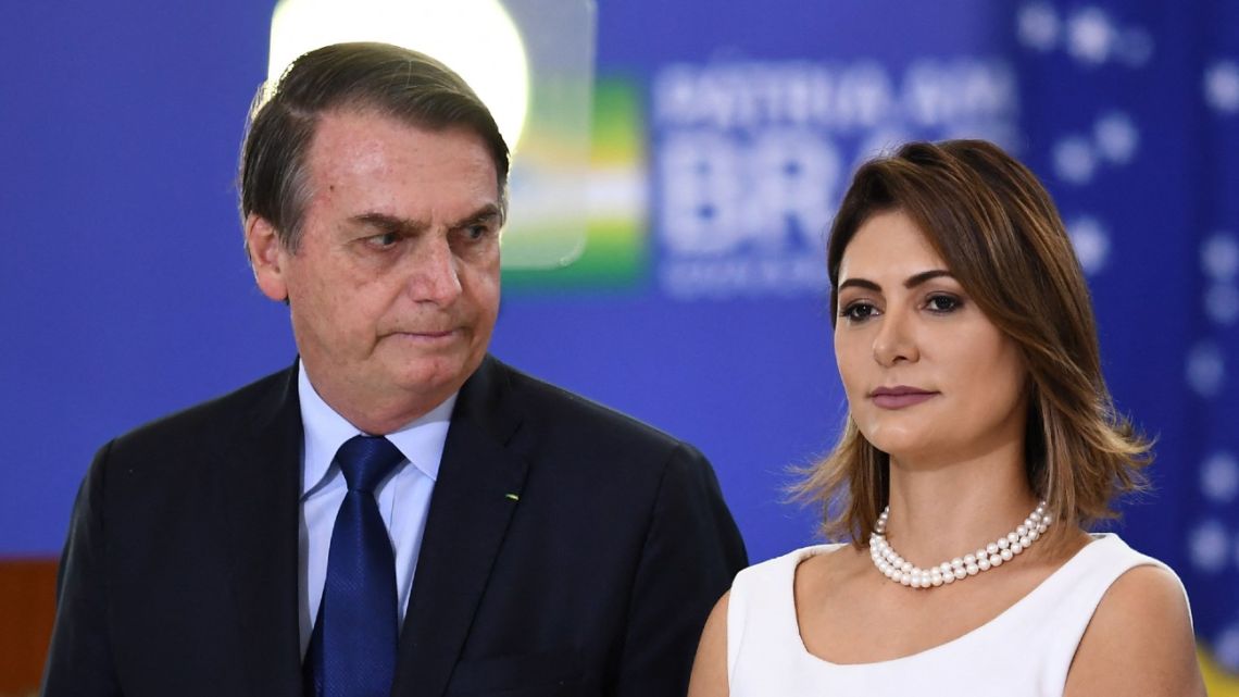 In this file photo from April of 2019, Brazilian President Jair Bolsonaro and first lady Michelle attend the new general officers' promotion ceremony in Brasília.