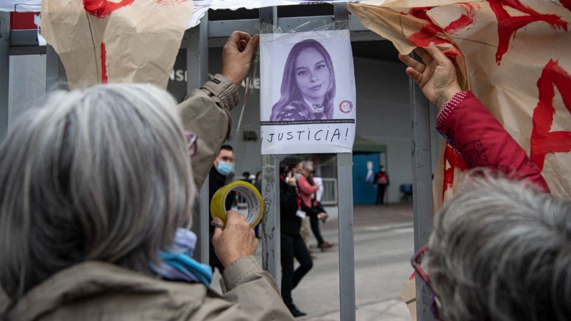 Women place a photograph of journalist Francisca Sandoval outside the Hospital of Urgencias y Asistencia Publica (HUAP) after learning of her death in Santiago, on May 12, 2022. 
