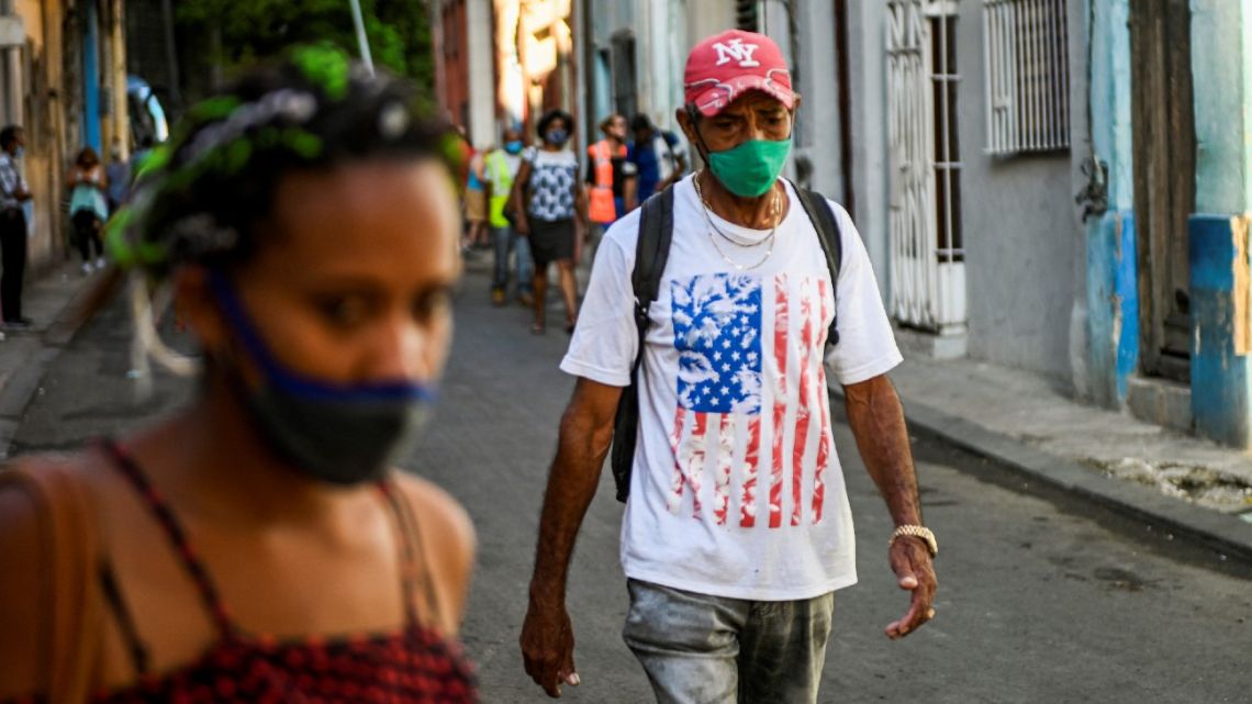 A man wearing a T-shirt with the US flag walks along a street of Havana, on May 17, 2022.