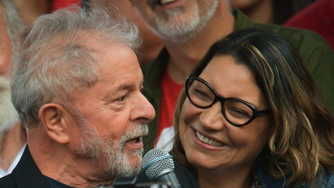 In this file photo taken in November 2019, former Brazilian President Luiz Inácio Lula da Silva speaks to supporters next to his now wife Rosangela da Silva after leaving the Federal Police Headquarters, in Curitiba, Brazil.