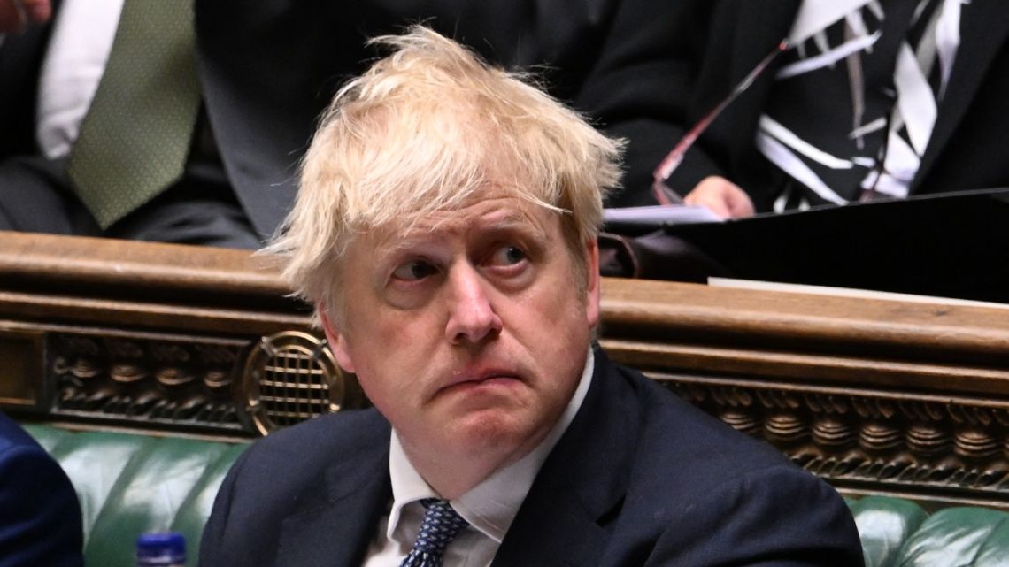 A handout photograph taken and released by the UK Parliament shows Britain's Prime Minister Boris Johnson during his statement on the Sue Gray report, in the House of Commons in London, on May 25, 2022.