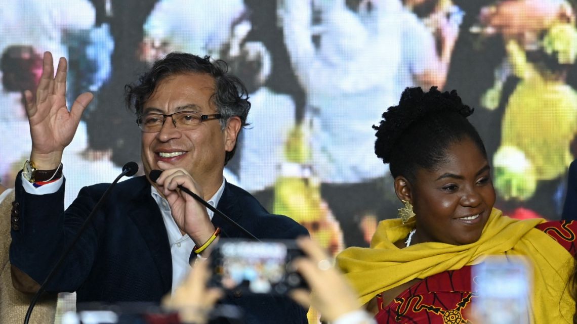 Colombian presidential candidate for the Historic Pact coalition Gustavo Petro (L) and his running mate Fráncia Marquez (R), celebrate in Bogotá on May 29, 2022. Following the official results Petro will face populist outsider Rodolfo Hernández in a runoff election on June 19.