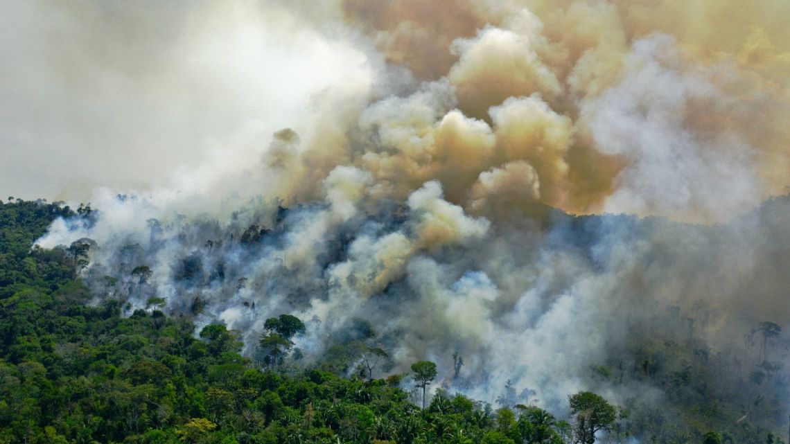 This file photo taken on August 16, 2020, shows an aerial view of a burning area of Amazon rainforest reserve south of Novo Progresso in Para state, Brazil.