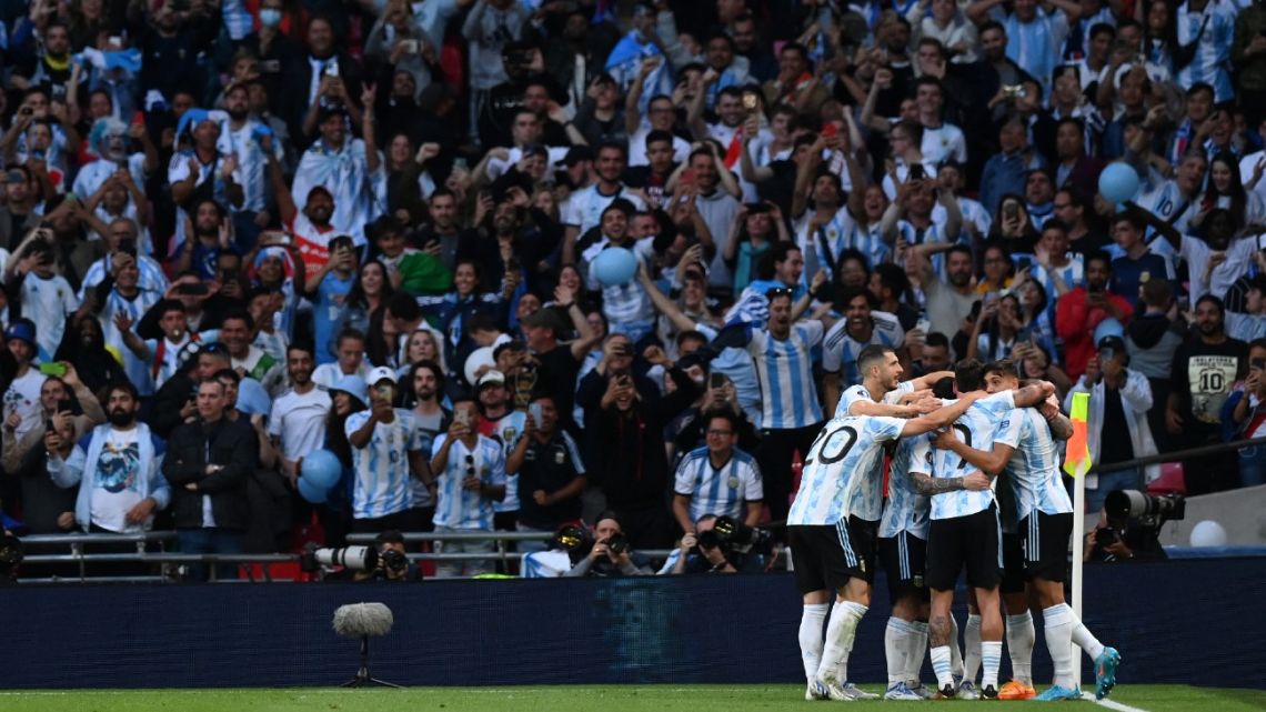 Argentina celebrate after their second goal during the 'Finalissima' International friendly football match between Italy and Argentina at Wembley Stadium in London on June 1, 2022.