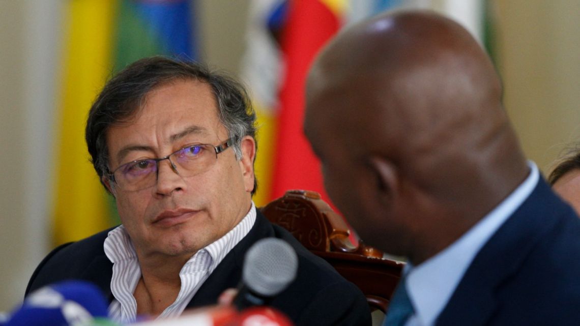 The Colombian presidential candidate for the Historic Pact coalition, Gustavo Petro (L), listens during a press conference in Bogotá on May 31, 2022.