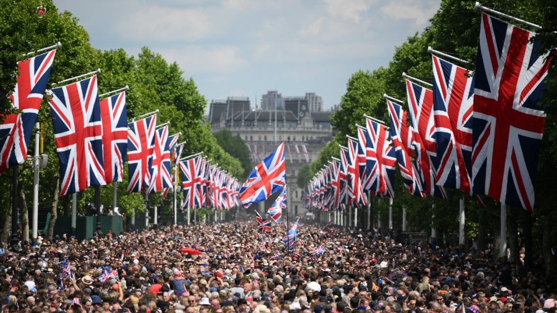 Members of the public fill The Mall before a flypast during the Queen's Birthday Parade, the Trooping the Colour, as part of Queen Elizabeth II's Platinum Jubilee celebrations, in London on June 2, 2022.