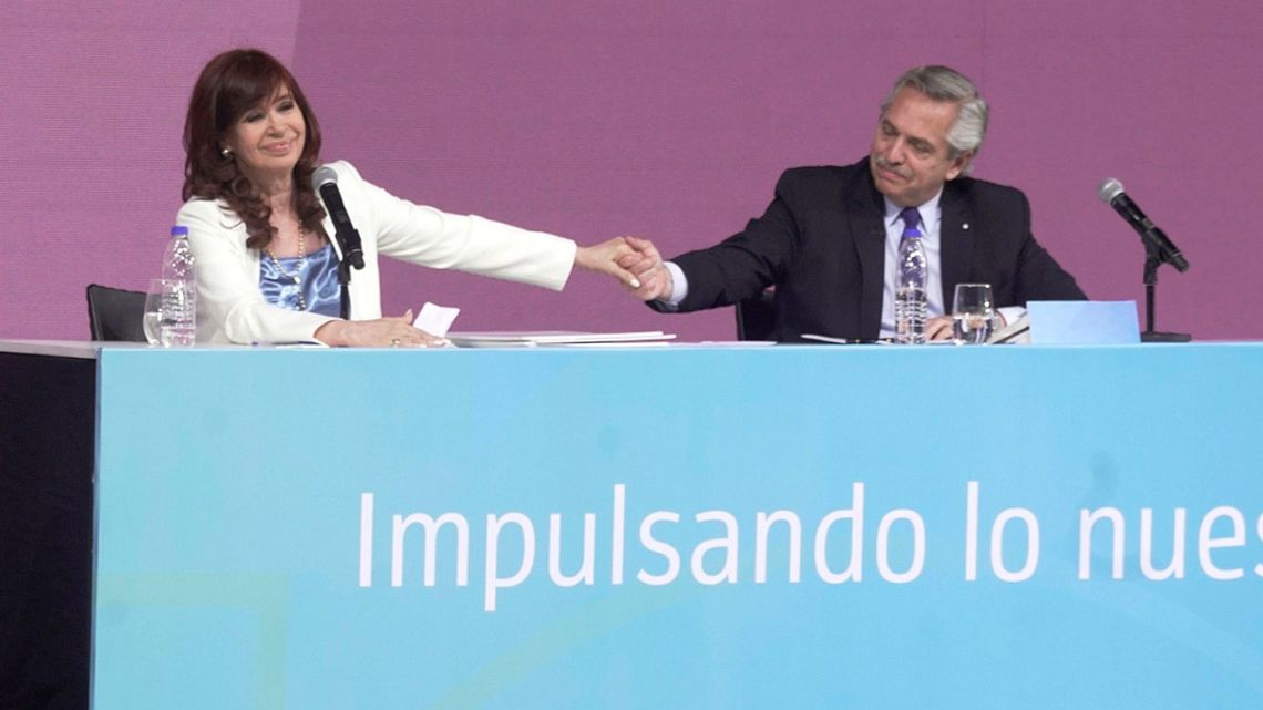 Alberto Fernández, Argentina's president, right, and Cristina Fernández de Kirchner, Argentina's vice-president, hold hands during the 100th-anniversary event for state-owned YPF at Tecnopolis in Buenos Aires, Argentina, on Friday, June 3, 2022. 