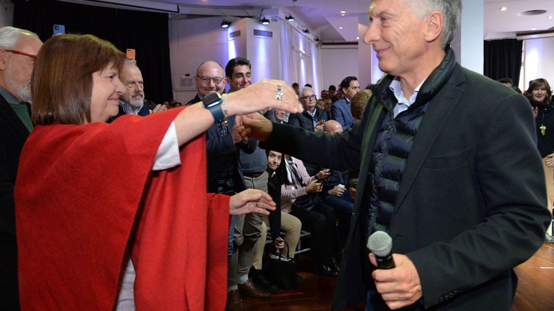Patricia Bullrich embraces Mauricio Macri.