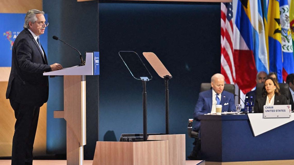 Argentina's President Alberto Fernández speaks during a plenary session of the Ninth Summit of the Americas in Los Angeles, California, June 9, 2022, as US President Joe Biden and US Vice-President Kamala Harris look on.