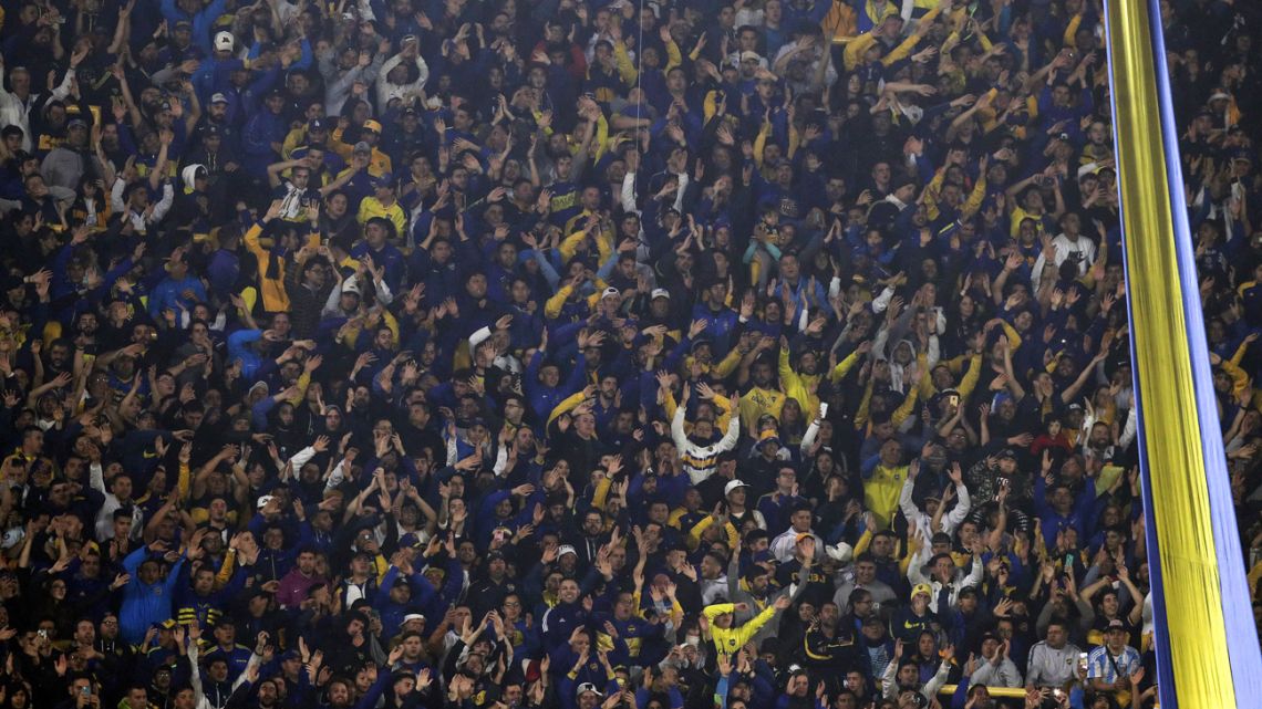 Supporters of Boca Juniors cheer for their team during their Argentine Professional Football League Tournament 2022 match against Arsenal at La Bombonera stadium in Buenos Aires, on June 5, 2022.