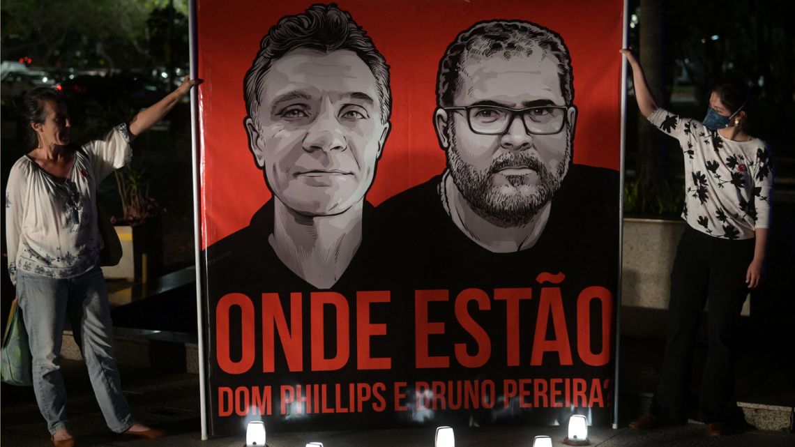 In this file photo taken on June 9, 2022 employees of the National Indigenous Foundation protest over missing British journalist Dom Phillips and Brazilian Indigenous affairs specialist Bruno Pereira, in Brasilia. 