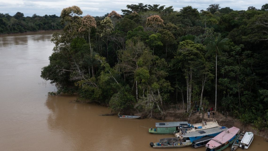 Aerial view showing indigenous members of the Union of Indigenous Peoples of the Javari Valley (UNIVAJA) who are looking for clues that lead to the whereabouts of veteran correspondent Dom Phillips and respected indigenous specialist Bruno Pereira, gathering on the banks of the Itaguaí river in Vale do Javari, municipality of Atalaia do Norte, state of Amazonas, Brazil, on June 13, 2022. 