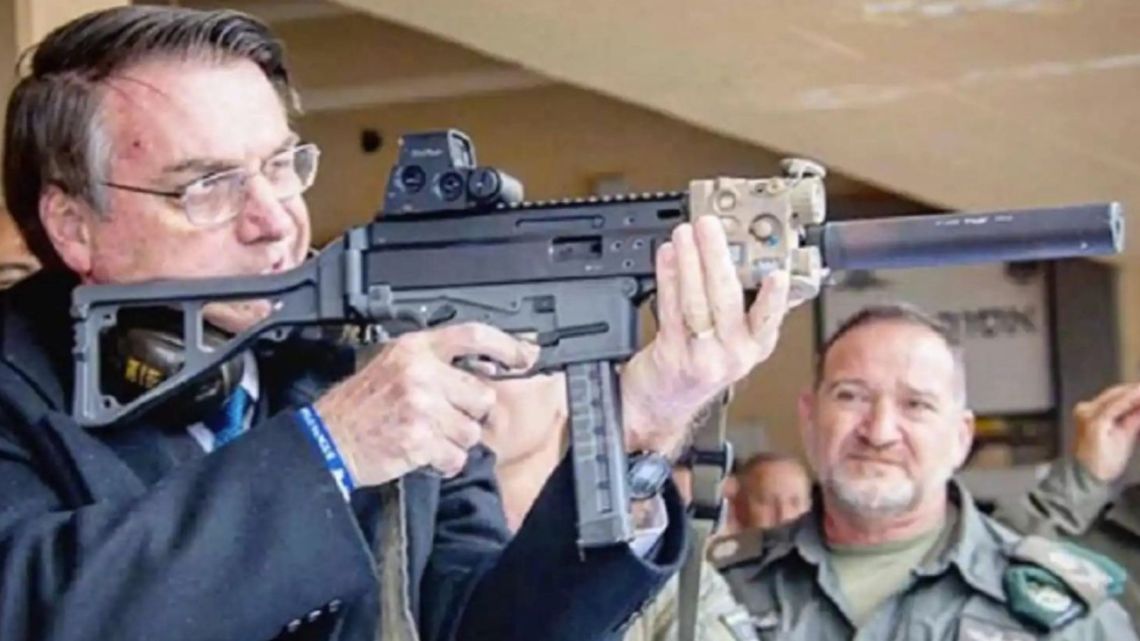 Brazil President Jair Bolsonaro, pictured with a firearm.