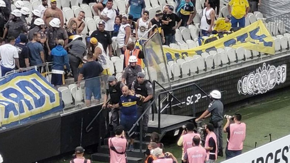 A Boca Juniors fan is arrested by police during the Xeneize's away match against Brazilian side Corinthians.