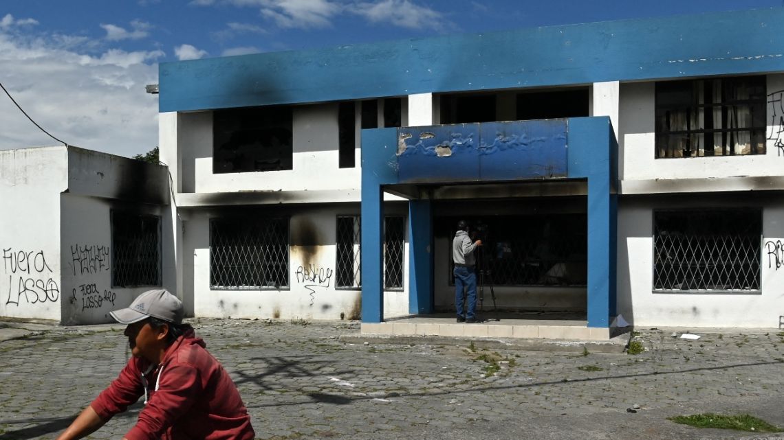 Picture of a police station burnt down by demonstrators in Calderon, a neighbourhood in the northern outskirts of Quito on June 29, 2022, in the framework of indigenous-led protests against high living costs. Ecuador's president survived an impeachment vote on Tuesday, as negotiations to end more than two weeks of cost-of-living protests by Indigenous groups were suspended following the death of a soldier. 