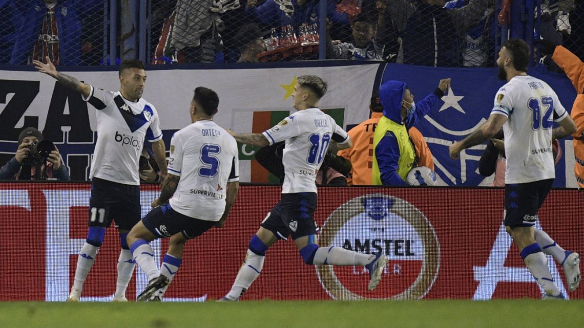 Vélez Sarsfield's Lucas Janson celebrates with teammates after scoring a penalty against River Plate during their Copa Libertadores football tournament round of sixteen all-Argentine first leg match, at the José Amalfitani stadium in Buenos Aires, on June 29, 2022. 