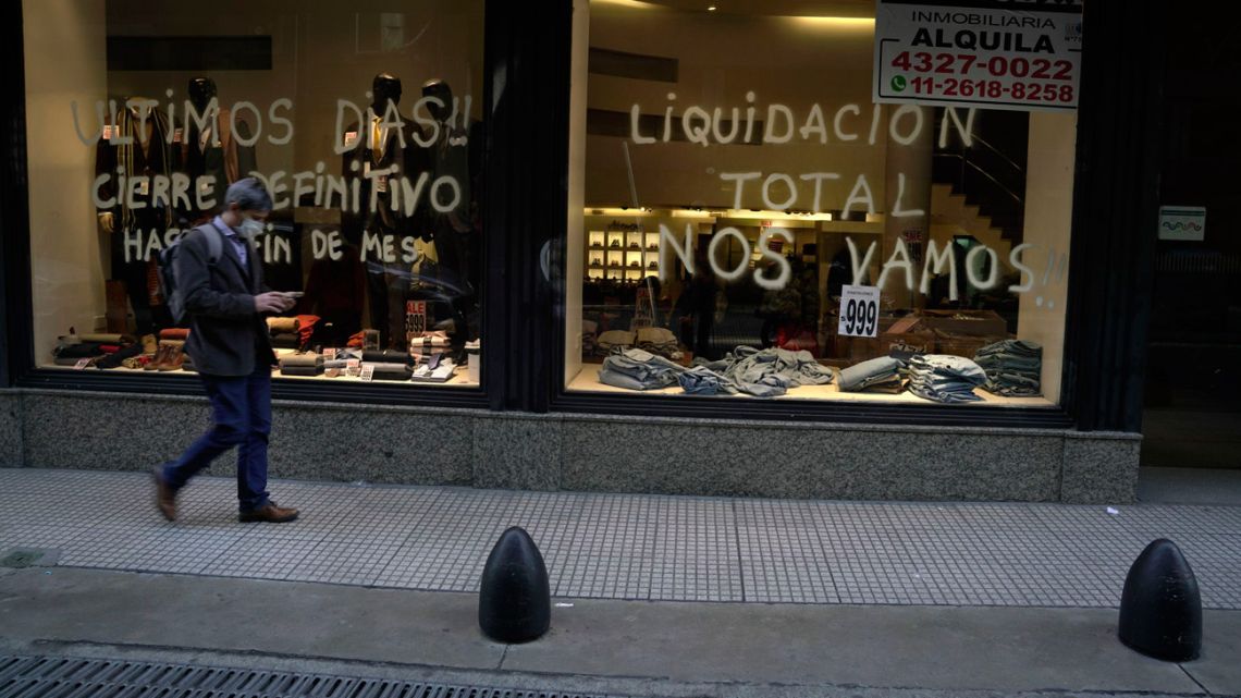 A store notifies customers of a liquidation sale before permanently closing in Buenos Aires, Argentina, on Thursday, July 7, 2022.