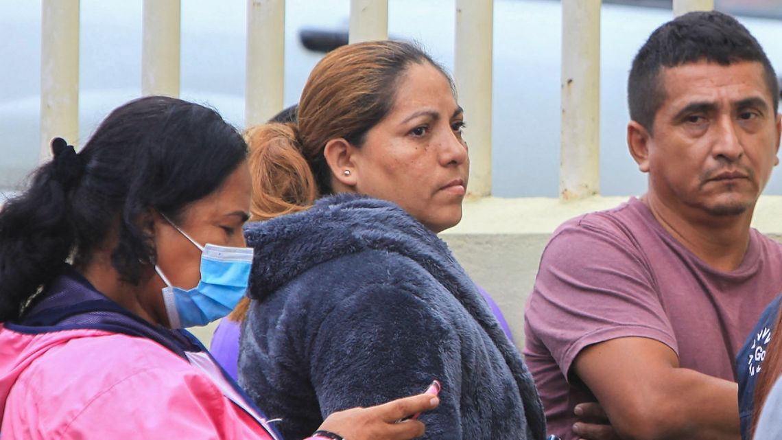 Relatives of inmates of the Bellavista prison, in the town of Santo Domingo de los Colorados, about 80 km from Quito, wait outside the morgue to learn the fate of their loved ones after 13 inmates were killed and two injured in a bloody fight between prisoners. Thirteen inmates were killed and two others injured on Monday in yet another bloody fight in a notorious Ecuadoran prison, law enforcement officials said. Prison officials, aided by the military and the police, were able to regain control of the facility, prison authority SNAI said. The incident took place at the same prison where 44 inmates were killed in a bloody brawl in May.
