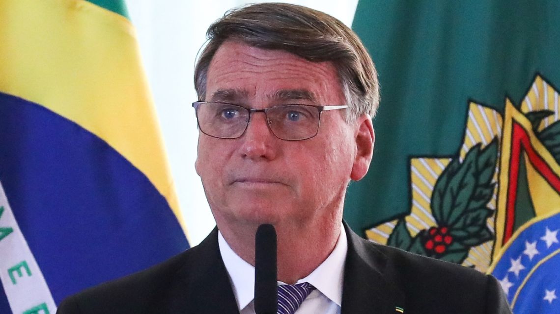 This handout picture released by the Brazilian Presidency shows Brazilian President Jair Bolsonaro speaking during a meeting with ambassadors to question Brazilian electoral system at the Planalto Palace in Brasilia, on July 18, 2022. President Jair Bolsonaro once again questioned the Brazilian electoral system, less than three months before the presidential election that all polls predict he will lose. "We want to correct the flaws, we want transparency, a real democracy," said the far-right leader, who has repeatedly sought to cast doubt over the country's electronic voting system. He continued to blast the voting system in a speech that lasted nearly an hour at the presidential palace in Brasilia, in front of several dozen ambassadors invited specifically to listen to him discuss the topic.