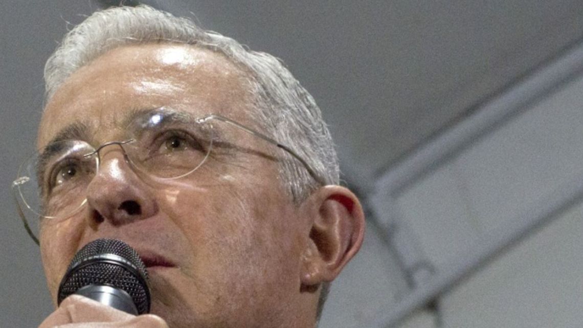 Alvaro Uribe, former president of Colombia, centre, speaks at the Centro Democratico Party's headquarters in Bogota, Colombia, on Tuesday, Oct. 8, 2019. Colombia peace tribunal charges 19 soldiers for 300 murders, which took place under the right-wing presidency of Uribe.