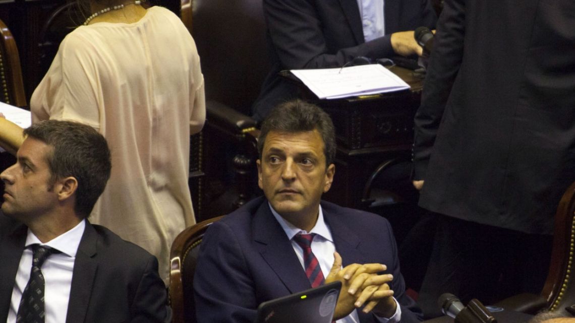 Sergio Massa, deputy of the Renovation Front party, center, attends a session of the lower house of Congress in Buenos Aires, Argentina, on Tuesday, March 15, 2016. Argentine President Mauricio Macri is winning support in Congress for a deal with creditors, ending a 15-year dispute with holdout bondholders and paving the way for new debt sales.
