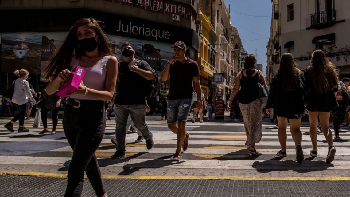 Pedestrians on Florida Street in Buenos Aires, Argentina, on Friday, Feb. 25, 2022. Argentina's economy capped a strong second half of growth as it emerged from a long recession last year ahead of an expected new deal in the coming weeks with the International Monetary Fund.