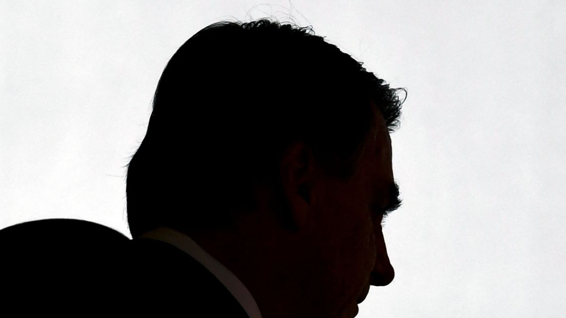 View of the silhouette of Brazilian President Jair Bolsonaro on arrival at the promotion ceremony of General Officers of the Armed Forces, at Planalto Palace in Brasilia, on August 4, 2022.